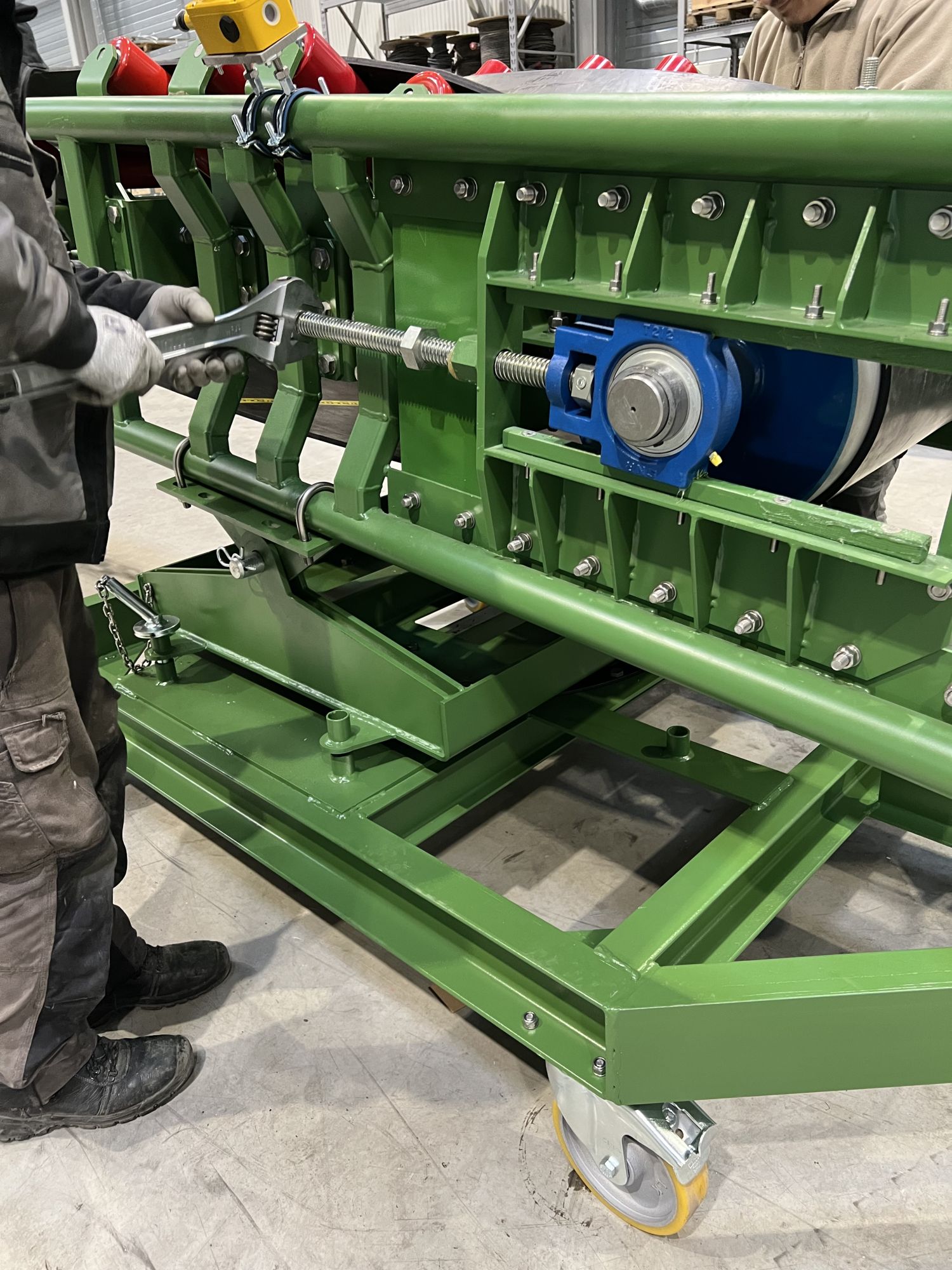 Adjustment of conveyor belt tension